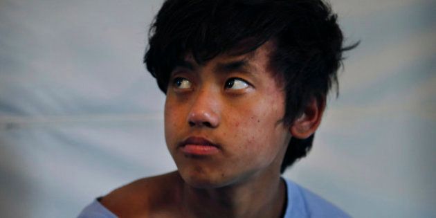 Pemba Tamang, 15, recovers at the Israeli field hospital for earthquake victims after being rescued in an operation led by a Nepalese team with American responders from the U.S. Agency for International Development assisting them, in Kathmandu, Nepal, Thursday, April 30, 2015. Crowds cheered Thursday as Tamang was pulled, dazed and dusty, from the wreckage of a seven-story Kathmandu building that collapsed around him five days ago when an enormous earthquake shook Nepal. (AP Photo/Manish Swarup)