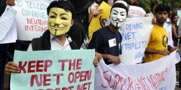 Indian activists wear Guy Fawkes masks as they hold placards during a demonstration supporting 'net neutrality' in Bangalore on April 23, 2015. The activists urged the Indian government to pass legislation to ensure net neutraliy and prevent private service providers from gaining control over the internet. AFP PHOTO / Manjunath KIRAN (Photo credit should read Manjunath Kiran/AFP/Getty Images)