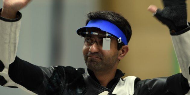 India's Abhinav Bindra reacts after winning the bronze medal in the men's 10m air rifle individual event at the Ongnyeon International shooting range of the 2014 Asian Games in Incheon on September 23, 2014. AFP PHOTO/ Indranil MUKHERJEE (Photo credit should read INDRANIL MUKHERJEE/AFP/Getty Images)