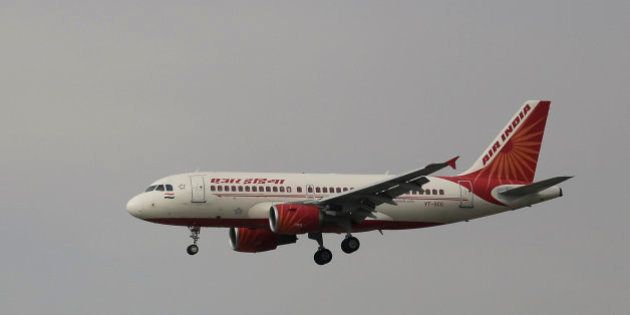 In this Thursday, April 16, 2015 photo, an Airbus A319 of Air India prepares to land at the Indira Gandhi International airport in New Delhi, India. (AP Photo/Altaf Qadri)