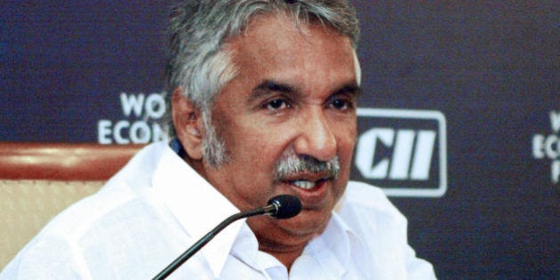 New Delhi, INDIA: Kerala Chief Minister of the Indian state of Kerala Oommen Chandy (L) answers a question during the third day of the 'India Economic Summit' in New Delhi, 29 November 2005. The 21st India Economic Summit which is organised jointly by the Confederation of Indian Industry (CII) and the World Economic Forum (WEF) is being held in from the 27th to 29th November with the theme of 'A Young and Resurgent India: its impact on regional and global strategies'. AFP PHOTO/RAVEENDRAN (Photo credit should read RAVEENDRAN/AFP/Getty Images)