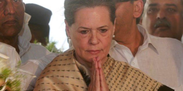 Congress party leader Sonia Gandhi, pays tributes to former Indian minister Murli Deora in Mumbai, India, Monday, Nov. 24, 2014. Deora, a senior Congress party leader passed away Monday after a prolonged illness.(AP Photo/Rafiq Maqbool)