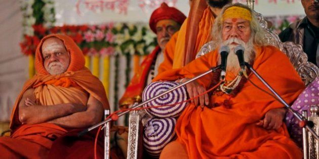 Indiaâs religious leaders Shankaracharya Swaroopanand Saraswati, right, and Puri Shankaracharya Swami Nischalananda Saraswati attend the âDharma Sansadâ or a religious parliament at Sangam, the confluence of the Rivers Ganges, Yamuna and mythical Saraswati during the annual traditional fair of âMagh Melaâ in Allahabad, India, Sunday, Jan. 18, 2015. Hundreds of thousands of devout Hindus are expected to take holy dips at the confluence during the astronomically auspicious period of over 45 days celebrated as Magh Mela. (AP Photo/Rajesh Kumar Singh)