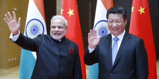 XIAN, CHINA - MAY 14: Indian Prime Minister Narendra Modi (Left) and Chinese President Xi Jinping attend a meeting on May 14, 2015 in Xian, Shaanxi province, China. (Photo by Kim Kyung-Hoon - Pool/Getty Images)