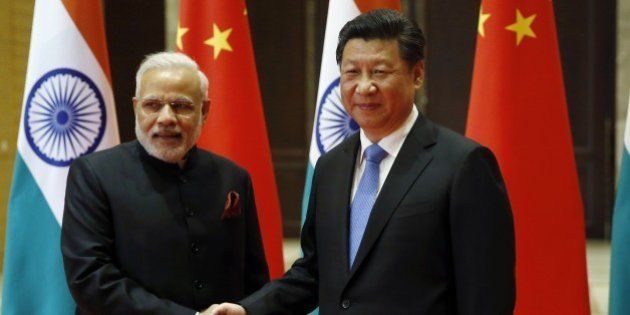 India's Prime Minister Narendra Modi (L) and China's President Xi Jinping shake hands before they hold a meeting in Xian, in China's Shaanxi province, on May 14, 2015. Modi began a three-day trip to China on May 14 by inspecting the Terracotta Warriors as a festering border dispute colours relations between the Asian giants. AFP PHOTO / POOL / Kim Kyung-Hoon (Photo credit should read KIM KYUNG-HOON/AFP/Getty Images)
