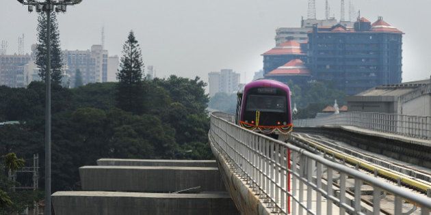 The Bangalore Metro Rail Corporation's Namma metro train start its inagural run in Bangalore on October 20, 2011. The first metro in India's IT hub of Bangalore rolls into service, a long-delayed and over-budget project to help the city's army of commuting software engineers and call centre staff. Despite its shiny corporate headquarters, Bangalore suffers from the same acute infrastructure problems that blight the rest of the country, with the city's reputation as a business-friendly, high-tech centre already in peril. AFP PHOTO/ Dibyangshu SARKAR (Photo credit should read DIBYANGSHU SARKAR/AFP/Getty Images)