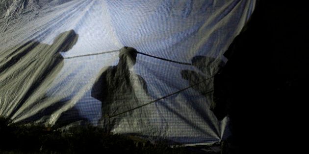 people rest inside a makeshift tent in an open space in Kathmandu, Nepal, Tuesday, May 12, 2015. A new earthquake Tuesday spread more fear and misery in Nepal, which is still struggling to recover from a devastating quake nearly three weeks ago that left thousands dead. (AP Photo/Niranjan Shrestha)