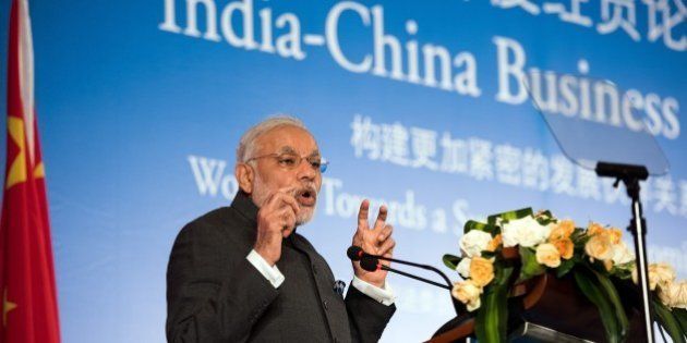 India's Prime Minister Narendra Modi delivers a speech at the India-China Business Forum in Shanghai on May 16, 2015. Indian and Chinese firms signed 21 agreements officials said were worth a total of more than 22 billion USD witnessed by visiting Prime Minister Narendra Modi. AFP PHOTO / JOHANNES EISELE (Photo credit should read JOHANNES EISELE/AFP/Getty Images)