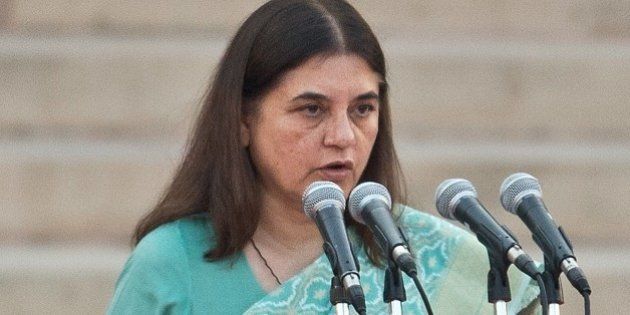 In this photograph taken on May 26, 2014, Bharatiya Janata Party (BJP) leader Maneka Gandhi takes the oath of office during a swearing-in ceremony for new Indian Prime Minister Narendra Modi and his council of ministers in New Delhi. India's Prime Minister Narendra Modi was expected to hold landmark talks with his Pakistani counterpart and announce his new cabinet May 27 as he looked to hit the ground running on his first day in office. AFP PHOTO/Prakash SINGH (Photo credit should read PRAKASH SINGH/AFP/Getty Images)