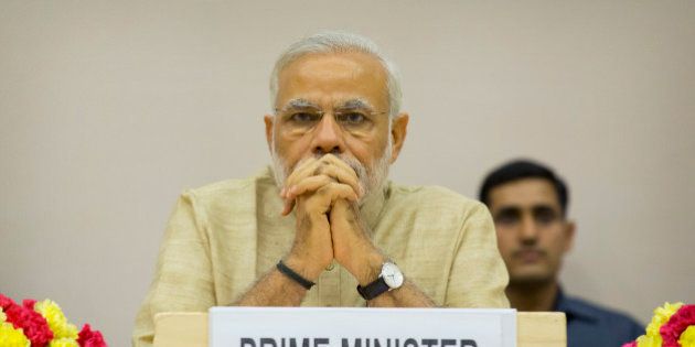 Indian Prime Minister Narendra Modi attends a function to mark the national Panchayati Raj or village civil council day, in New Delhi, India, Friday, April 24, 2015. Modi on Friday urged Panchayat members to work with a five-year vision with concrete development plans to bring about positive changes in their village and also emphasized on the need for education, according to local reports. (AP Photo/Manish Swarup)