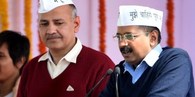 Aam Aadmi Party (AAP) president Arvind Kejriwal (R), with fellow AAP minister Manish Sisodia, addresses supporters during Kejriwal's swearing-in ceremony as Delhi chief minister in New Delhi on February 14, 2015. Arvind Kejriwal promised to make Delhi India's first corruption-free state and end what he called its 'VIP culture' as he was sworn in as chief minister before a huge crowd of cheering supporters . AFP PHOTO / PRAKASH SINGH (Photo credit should read PRAKASH SINGH/AFP/Getty Images)