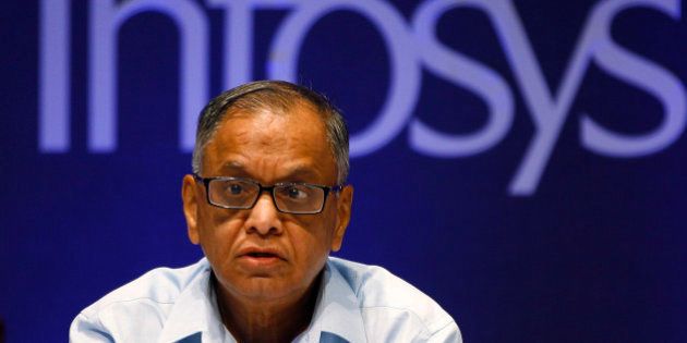 FILE- In this June 15, 2013 file photo, Infosys Executive Chairman N. R. Narayana Murthy reacts to a shareholders comment during the company's 32th Annual General Meeting in Bangalore, India. In 2013 Infosys was accused of bringing thousands of foreign workers to the United States using incorrect visas, but denied any allegations as part of the settlement reached with a $34 million settlement in Texas. (AP Photo/Aijaz Rahi)