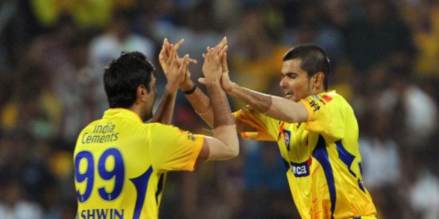 Chennai Super Kings fielder Badrinath (R) celebrates with his teammate after taking a catch to dismiss Kolkata Knight Riders batsman Yousuf Pathan during the IPL Twenty20 cricket final match between Chennai Super Kings (CSK) and Kolkata Knight Riders (KKR) at the M.A. Chidambaram Stadium in Chennai on May 27, 2012. RESTRICTED TO EDITORIAL USE. MOBILE USE WITHIN NEWS PACKAGE. AFP PHOTO/Manjunath KIRAN (Photo credit should read Manjunath Kiran/AFP/GettyImages)