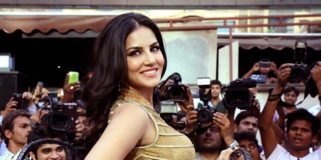 Indian actress and former adult film actress Sunny Leone poses for a photograph during a promotional event for the Hindi film Ragini MMS 2 in Mumbai on late March 26, 2014. AFP PHOTO / STR (Photo credit should read STRDEL/AFP/Getty Images)