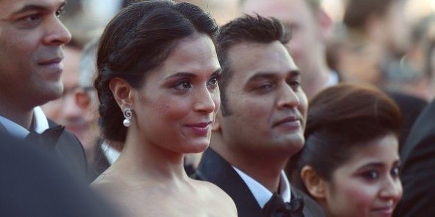 Indian producer Vikramaditya Motwane (L), Indian actress Richa Chadda (2ndL), Indian producer Manish Mundra and Indian actress Shweta Tripathi pose as they arrive for the screening of the film 'Masaan' at the 68th Cannes Film Festival in Cannes, southeastern France, on May 19, 2015. AFP PHOTO / ANNE-CHRISTINE POUJOULAT (Photo credit should read ANNE-CHRISTINE POUJOULAT/AFP/Getty Images)