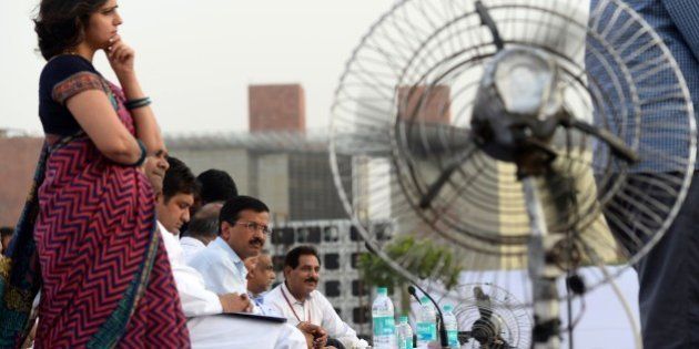Chief Minister of India's capital New Delhi Arvind Kejriwal (3L) looks on during a public cabinet meeting in Central Park at Connaught Place in New Delhi on May 25,2015, after completing 100 days in office. AFP PHOTO/SAJJAD HUSSAIN (Photo credit should read SAJJAD HUSSAIN/AFP/Getty Images)