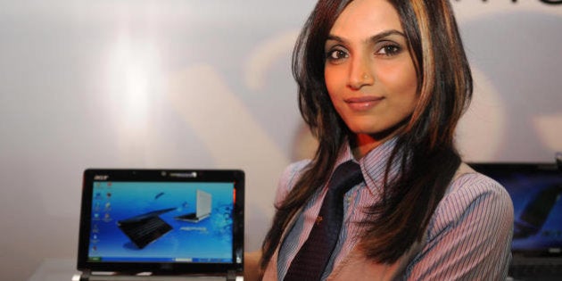 An Indian model poses with the Acer Gatway and eMachines PC during the launch in New Delhi on May 26, 2009. Acer, the third largest PC brand globally, announced the launch of two global PC brands into the Indian market as part of its worldwide multibrand strategy, kickstarted with the acquisition of Gateway in the US in 2007. AFP PHOTO/RAVEENDRAN (Photo credit should read RAVEENDRAN/AFP/Getty Images)