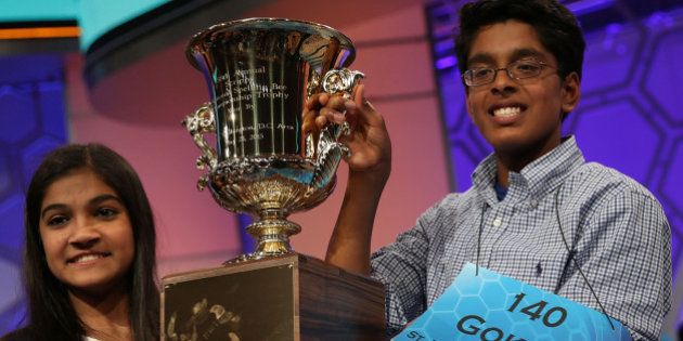 NATIONAL HARBOR, MD - MAY 28 Speller Vanya Shivashankar (L) of Olathe, Kansas, and speller Gokul Venkatachalam (R) of St. Louis, Missouri, hold up the trophy after winning the 2015 Scripps National Spelling Bee May 28, 2015 in National Harbor, Maryland. Shivashankar and Venkatachalam were declared co-champion at the annual spelling competition. (Photo by Alex Wong/Getty Images)