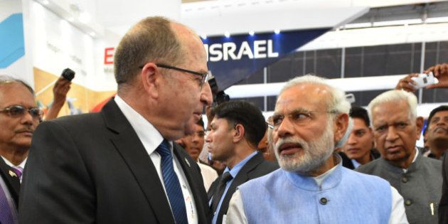BANGALORE, INDIA - FEBRUARY 18: (ISRAEL OUT) In this handout provided by the Israeli Ministry of Defence, Israeli Defense Minister Moshe Ya'alon visits the arms exhibition in India with Indian Prime Minister Narendra Modi at Aero India 2015 on February 18, 2015 in Bangalore, India. Defense Minister Moshe Ya'alon is in India, marking the first state visit by an Israeli defense minister to that nation. (Photo by Ariel Hermoni-Levine /Israeli Ministry of Defense via Getty Images)