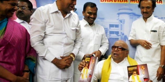 Leader of the Dravida Munnetra Kazhagam party M. Karunanidhi, seated, releases his partyâs election manifesto for the upcoming elections, surrounded by party leaders, from right, M.K. Stalin, Andimuthu Raja, T.R. Balu and Kanimozhi, in Chennai, India, Tuesday, March 11, 2014. India will hold national elections from April 7 to May 12, kicking off a vote that many observers see as the most important election in more than 30 years in the world's largest democracy. (AP Photo/Arun Sankar K.)