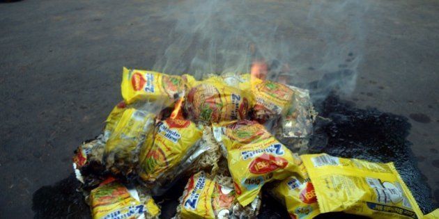 Indian social activists burn packets of Nestle's Maggi instant noodles during a protest in Kolkata on June 4, 2013. The food and consumer affairs ministry said June 3 that it was concerned over reports that the popular two-minute noodles contained high levels of lead, which can cause hypertension, harm the kidneys and in extreme cases lead to death as the government said it was testing samples from across the country to check if they contained lead in excess. AFP PHOTO/ Dibyangshu Sarkar (Photo credit should read DIBYANGSHU SARKAR/AFP/Getty Images)