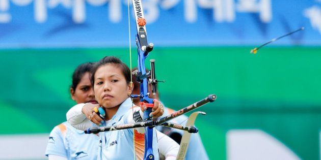 INCHEON, SOUTH KOREA - SEPTEMBER 28: Laishram Bombayla Devi of India competes in the Archery Recurve Women's Team Bronze Medal Match in day nine during the 2014 Asian Games at Gyeyang Asiad Archery Field on September 28, 2014 in Incheon, South Korea. (Photo by Lintao Zhang/Getty Images)