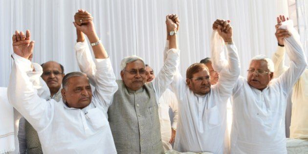 (L-R) Samajwadi Party chief Mulayam Singh Yadav, Nitish Kumar, chief minister of Bihar, Sharad Yadav of the Janata Dal (United) party, Lalu Prasad Yadav of Rashtriya Janata Dal party pose for photographers ahead of a press conference in New Delhi on April 15, 2015. Six Indian left-leaning and regional political parties vowed to work together to take on Prime Minister Narendra Modi's right-wing Bharatiya Janata Party ahead of key Bihar state elections scheduled later in the year. AFP PHOTO / SAJJAD HUSSAIN (Photo credit should read SAJJAD HUSSAIN/AFP/Getty Images)