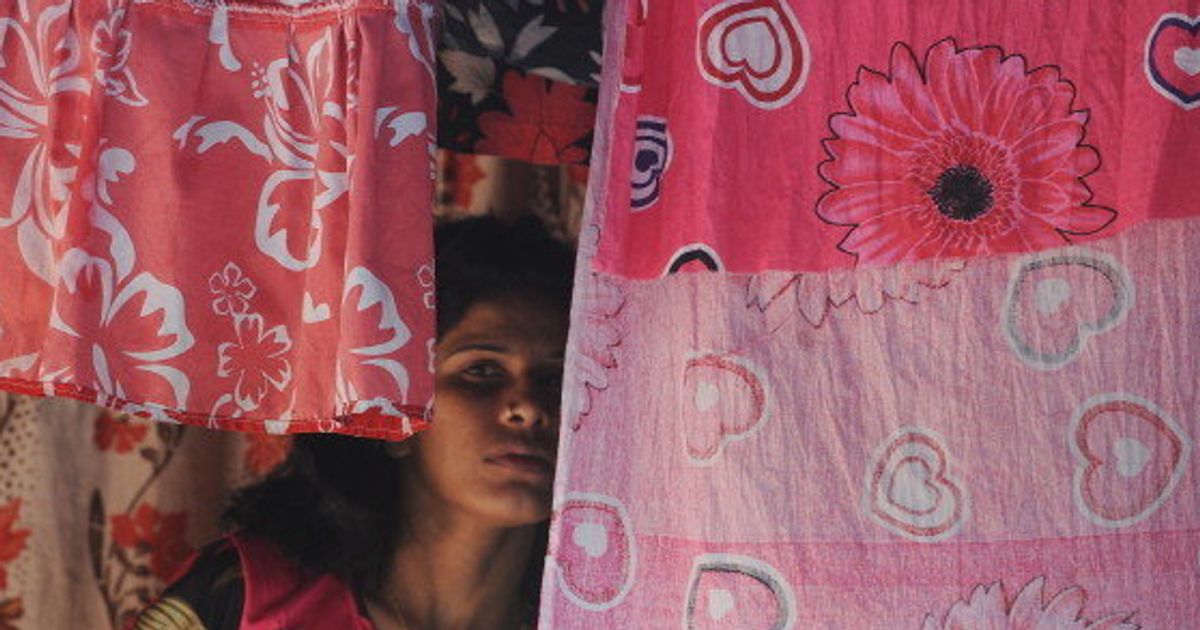 Fiorze and Sadik smoke brown sugar (heroin) in alley in the red light  district of Kamatipura