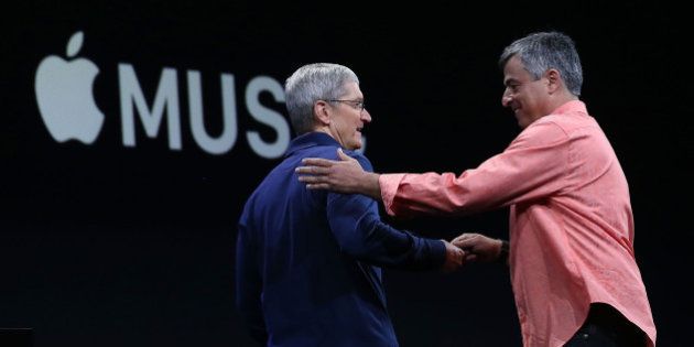 SAN FRANCISCO, CA - JUNE 08: Apple's senior vice president of Internet Software and Services Eddy Cue (R) greets Apple CEO Tim Cook (L) during the Apple WWDC on June 8, 2015 in San Francisco, California. Apple annouced a new OS X, El Capitan, iOS 9 and Apple Music during the keynote at the annual developers conference that runs through June 12. (Photo by Justin Sullivan/Getty Images)