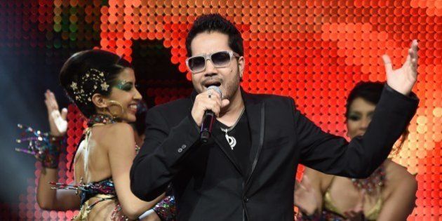 Bollywood singer Mika Singh performs on stage at the Mid Florida Credit Union Amphitheater during the IIFA Magic of the Movies show on the third day of the 15th International Indian Film Academy (IIFA) Awards in Tampa, Florida, April 25, 2014. AFP PHOTO JEWEL SAMAD (Photo credit should read JEWEL SAMAD/AFP/Getty Images)