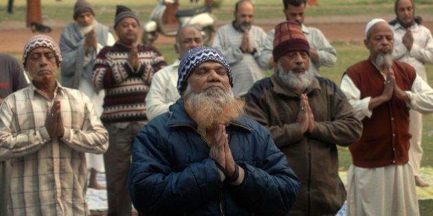 Indian Muslims perform Yoga in Ahmadabad, India, Monday, Dec. 21, 2009. More than fifty Muslim men and women are taking part in a yoga camp conducted by Naresh Patel, a retired Police officer in Ahmadabad. (AP Photo/Ajit Solanki)