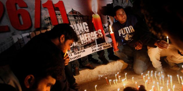 Indians participate in a candle light vigil in memory of those who lost their lives in the 2008 Mumbai terror attacks on its anniversary in New Delhi, India, Monday, Nov. 26, 2012. India Wednesday executed the lone surviving gunmen from the 2008 Mumbai terror attack, four years after Pakistani gunmen blazed through India's financial capital, killing 166 people and shattering relations between the nuclear-armed neighbors. (AP Photo/Tsering Topgyal)