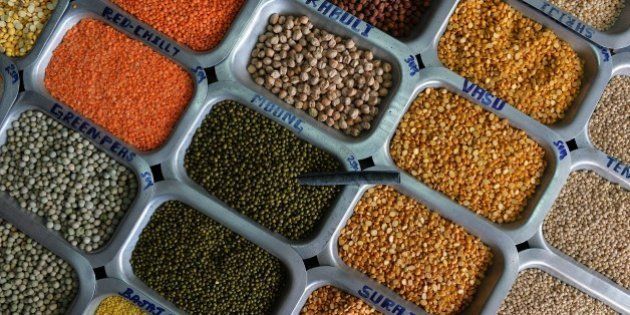 Pulses and food grains are seen for sale at a shop at the Agricultural Produce Marketting Committee (APMC) Yard in the Indian city of Bangalore on October 29, 2014. AFP PHOTO/Manjunath KIRAN (Photo credit should read MANJUNATH KIRAN/AFP/Getty Images)