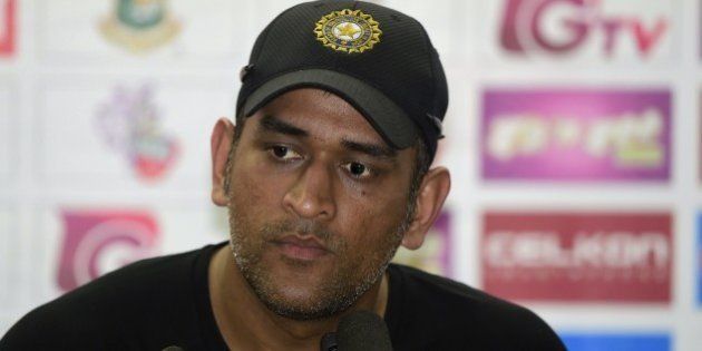 Indian cricket captain Mahendra Singh Dhoni speaks with the press after a practice session at the Sher-e-Bangla National Cricket Stadium in Dhaka on June 17, 2015, ahead of the first ODI (One Day International) cricke match against Bangladesh. AFP PHOTO/Munir uz ZAMAN (Photo credit should read MUNIR UZ ZAMAN/AFP/Getty Images)