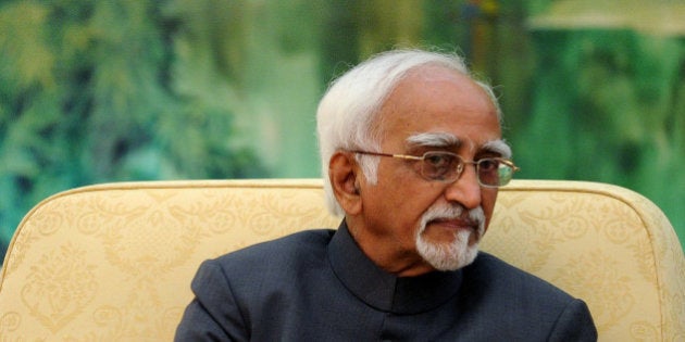 BEIJING, CHINA - JUNE 30: Indian Vice President Shri Mohammad Hamid Ansari talks as he meets with Chinese President Xi Jinping (not in picture) at the Great Hall of the People on June 30, 2014 in Beijing, China. Shri Mohammad Hamid Ansari is on a visit to China from June 26 - 30. (Photo by Wang Zhao - Pool / Getty Images)