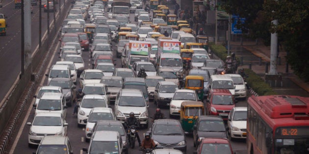 In this Thursday, Jan. 22, 2015 photo, traffic moves at dusk in New Delhi, India. When U.S. President Barack Obama visits New Delhi from Sunday, he will join the Indian capital's masses in breathing some of the world's filthiest air. Hazy skies will serve as the backdrop to meetings with Indian Prime Minister Narendra Modi and other officials who are expected to discuss India's biggest environmental woes: Heavy reliance on fossil fuels that has transformed New Delhi into the planet's most polluted capital and made India the third biggest national emitter of greenhouse gases. (AP Photo/Manish Swarup)