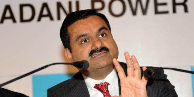 Adani Group Chairman, Gautam Adani addresses the media in Ahmedabad on July 21, 2009. Adani spoke about 'Adani Power Limited IPO' which opens on July 28. AFP PHOTO/ Sam PANTHAKY (Photo credit should read SAM PANTHAKY/AFP/Getty Images)