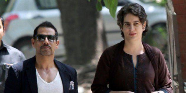 Priyanka Gandhi (R), daughter of India's Congress Party president Sonia Gandhi, and her husband Robert Vadra arrive at a polling station to cast their votes in New Delhi on April 10, 2014. The third phase of voting in India's national elections began at 7:00 am (0130 GMT) in 91 constituencies, representing nearly a fifth of the 543-seat lower house, across the capital and 13 other states, including Maoist insurgency-hit eastern India. AFP PHOTO/RAVEENDRAN (Photo credit should read RAVEENDRAN/AFP/Getty Images)