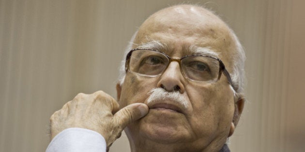 Bhartiya Janta Party (BJP) President L.K. Advani listens to Indian Prime Minister Manmohan Singh's speech during the Indian National Integration Council meeting in New Delhi on September 23, 2013. Measures to prevent communal disturbances and to tackle them will be discussed at the National Integration Council meeting, convened against the backdrop of Muzaffarnagar riots in Uttar Pradesh that has claimed 48 lives. AFP PHOTO/ Prakash SINGH (Photo credit should read PRAKASH SINGH/AFP/Getty Images)