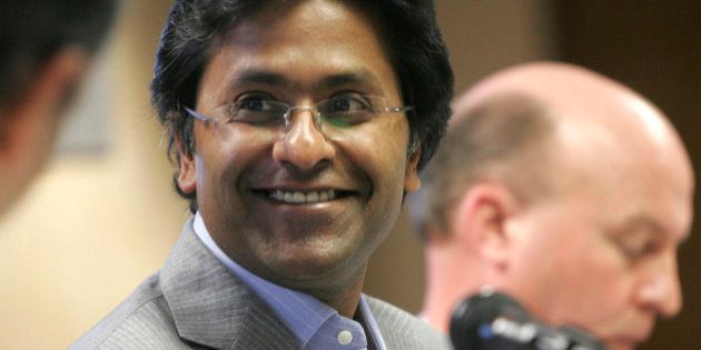 Chairman of the Indian Premier League Lalit Modi smiles at a news conference in Johannesburg, Tuesday, March 24, 2009. Modi announced that the Indian Premier League's Twenty20 cricket tournament will be played in South Africa from April 18. (AP Photo/Denis Farrell)