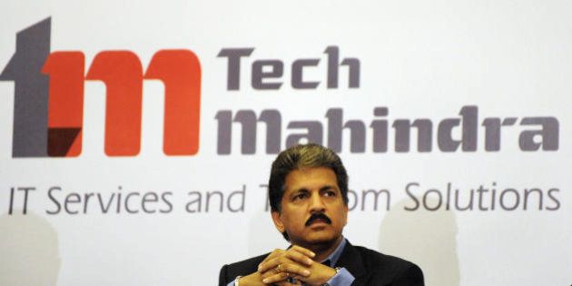 Chairman of Tech Mahindra, Anand Mahindra listens to a question during a press conference in Hyderabad on April 20, 2009. India's Tech Mahindra has won the bid for Satyam Computers Sevices in a sale aimed at giving the scandal-hit outsourcing giant vital fresh capital and a new begining. AFP PHOTO / Noah SEELAM (Photo credit should read NOAH SEELAM/AFP/Getty Images)