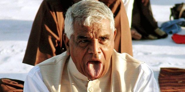 Chief Minister of Indian state of Madhya Pradesh Babulal Gaur participates in Yoga class organized by Acharya Baba Ramdev, in Indore 200 kilometers (125 miles) from Bhopal, India, Wednesday March 16, 2005. (AP Photo)