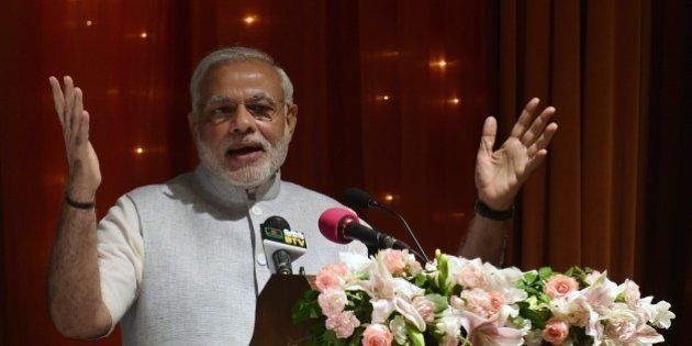 Indian Prime Minister Narendra Modi delivers a speech at presidential residence Bangabhaban in the Bangladesh capital Dhaka on June 7, 2015. Bangladesh and India on June 6, 2015 sealed a historic land pact to swap territories, which will finally allow tens of thousands of people living in border enclaves to choose their nationality after decades of stateless limbo. AFP PHOTO/ Munir uz ZAMAN (Photo credit should read MUNIR UZ ZAMAN/AFP/Getty Images)