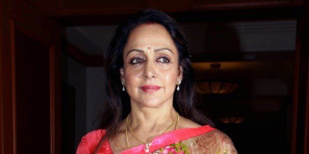 Indian Bollywood actress Hema Malini poses as she attend a press conference to announce the second national ' Yash Chopra Memorial Awards in Mumbai on November 20, 2014. AFP PHOTO/STR (Photo credit should read STRDEL/AFP/Getty Images)
