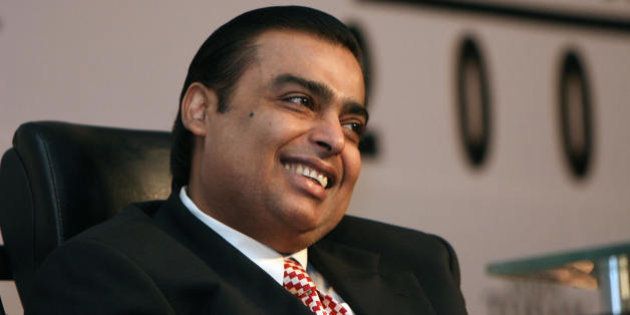 Chairman and Managing Director of India's Reliance Industries Ltd, Mukhesh Ambani smiles as he attends a session at The India Today Conclave - 'Leadership for the 21st Century' in New Delhi on March 14, 2008. During the inaugural keynote address for the conclave via satellite on March 13, former US President Bill Clinton indicated that any future administration would 'honour' the Indo-US nuclear deal after forthcoming US presidential elections amid speculation about the fate of the agreement which is yet to be ratified. Key US senators and top officials have stepped up pressure on New Delhi to speed up steps so the pact can get final approval from the US Congress, where it has bipartisan support, before the US presidential polls in November 2008. AFP PHOTO/RAVEENDRAN (Photo credit should read RAVEENDRAN/AFP/Getty Images)