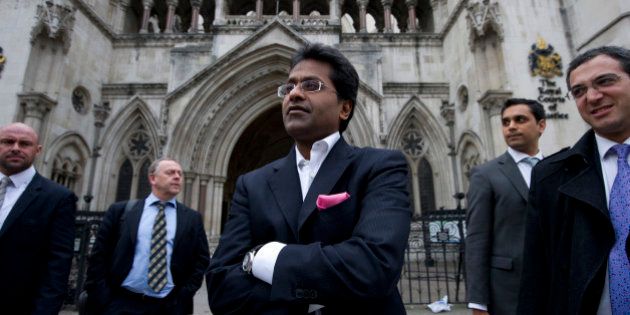 Ex-chairman of India's cricket IPL, Lalit Modi (C), leaves the High Court in central London on March 5, 2012, after a hearing in a libel case brought against him by Former New Zealand cricket captain Chris Cairns. Cairns told the High Court in London on Monday that an accusation of match-fixing had reduced his career to 'dust' and strained his marriage. Cairns, 41, is suing Lalit Modi, the former chairman of Twenty20 franchise the Indian Premier League (IPL), for substantial libel damages over an 'unequivocal allegation' made on Twitter. AFP PHOTO / CARL COURT (Photo credit should read CARL COURT/AFP/Getty Images)