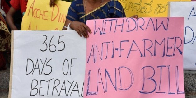 Activists stage a protest against Prime Minister Narendra Modi's government in Bangalore on June 6, 2015. Modi was put on the defensive last month by the suicide of a farmer at a rally in New Delhi against the land bill, a death seized on by opponents as an example of his administration's insensitivity towards those on the land. AFP PHOTO/Manjunath KIRAN (Photo credit should read MANJUNATH KIRAN/AFP/Getty Images)