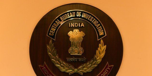 The logo of India's Central Bureau of Investigation (CBI) is seen during a press conference by newly-elected CBI director Anil Kumar Sinha in New Delhi on December 3, 2014. The CBI is an Indian governmental agency that jointly serves as a criminal investigation body, national security agency and intelligence agency. AFP PHOTO / CHANDAN KHANNA (Photo credit should read Chandan Khanna/AFP/Getty Images)