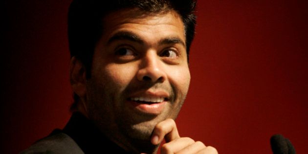 Bollywood film maker Karan Johar gestures as he participates in a conclave of leaders organized by an Indian media group, in New Delhi, India, Saturday, March 7, 2009. (AP Photo/Gemunu Amarasinghe)