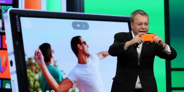 SAN FRANCISCO, CA - APRIL 02: Nokia executive vice president Stephen Elop takes a picture using the new Nokia Lumia 930 smartphone as he speaks during a keynote address during the 2014 Microsoft Build developer conference on April 2, 2014 in San Francisco, California. The 2014 Microsoft Build developer conference runs through April 4. (Photo by Justin Sullivan/Getty Images)